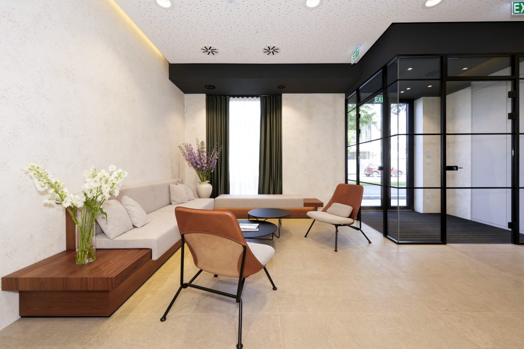 The DC360 consultation area with a table and armchairs